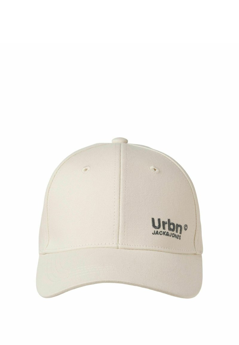Light beige baseball cap made of fabric with a curved brim, featuring a dark gray "Urbn" logo and matching stitching on the front.