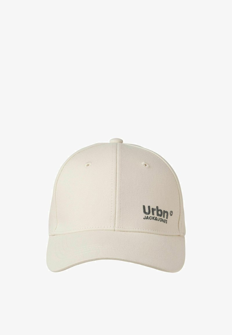 Light beige baseball cap made of fabric with a curved brim, featuring a dark gray "Urbn" logo and matching stitching on the front.