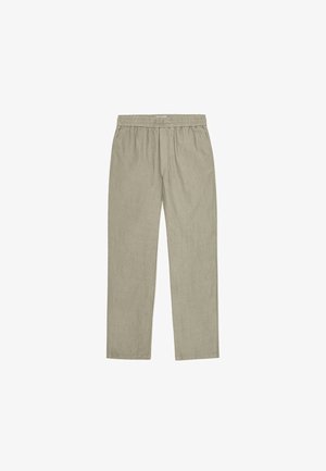 Light green, loose-fitting pants made of textured fabric, featuring an elastic waistband with a drawstring for adjustable fit.