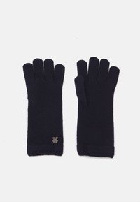 Marineblauwe vingerloze handschoenen van gebreide stof, met een geribbelde textuur en een klein gouden logo accent bij de pols.