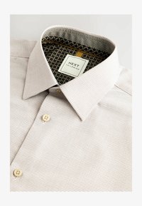 Valitud, neutral brown texture