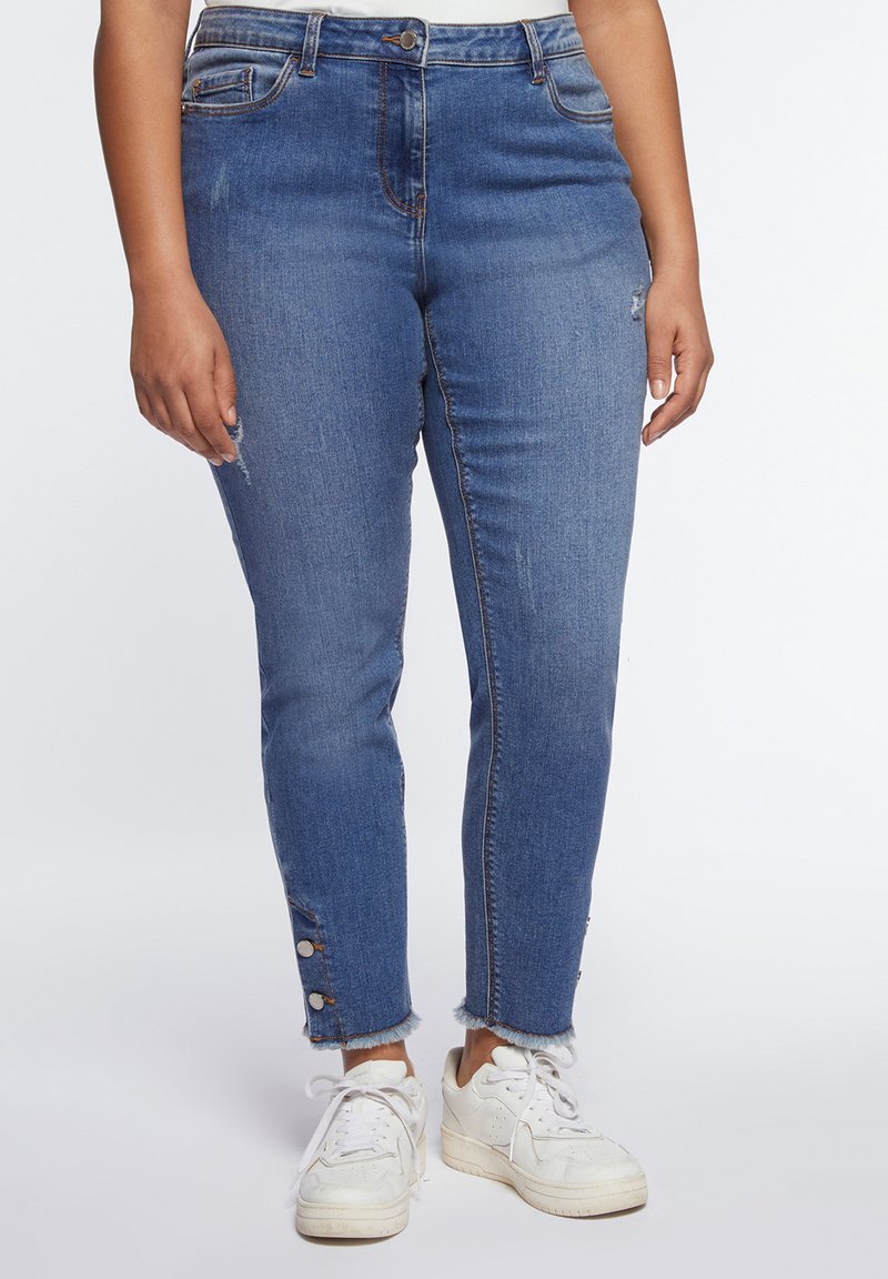 jeans con le tasche laterali