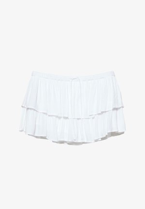 Biela viacvrstvová minisukňa s elastickým pásom a šnúrkou, vyrobená z ľahkej, priedušnej látky s vrstvenými volánmi.