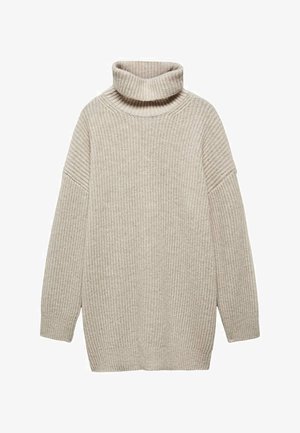 Pull à col roulé beige en tricot avec manches longues et texture côtelée, présentant des coutures d'épaule tombantes et une coupe décontractée.
