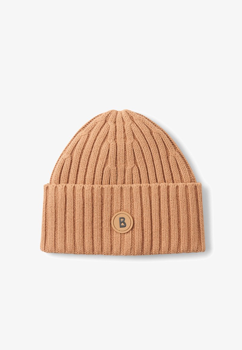 Beige knit beanie with ribbed texture and a folded cuff. Features a circular leather patch with a black "B" logo on the front.