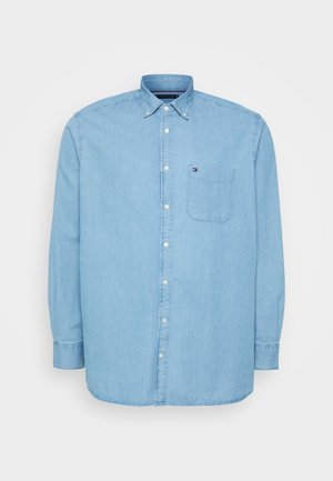 Lyseblå bomuldsskjorte med knapper, med brystlomme, krave og lange ærmer med manchetknapper. Ren, klassisk stil.