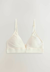 Bralette u krem boji s trokutastim oblikom, od mekanog materijala, podesivim naramenicama i teksturiranim pojasom na kojem se nalazi naziv 'NEXT.'