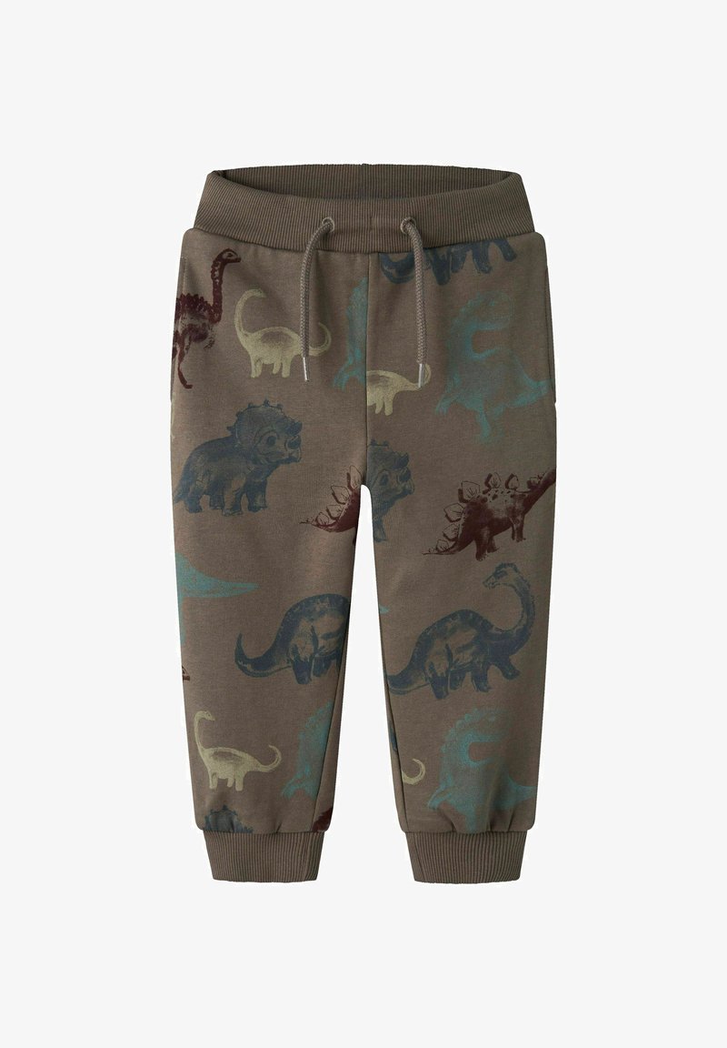 Brūnas sporta bikses ar dažādiem dinozauru rakstiem zilos, zaļos un bordo toņos. Elastīga josta un piedurknes, mīksts kokvilnas materiāls.