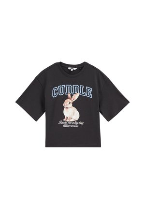 T-shirt noir à manches courtes avec une illustration de lapin et un texte disant "CUDDLE" et "Ready for a big hug, Collect Stories" sur le devant.