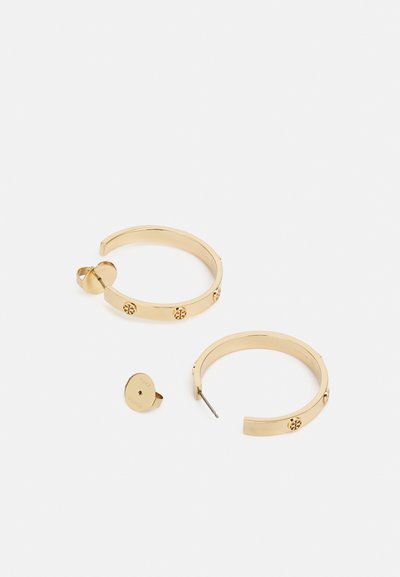 Gold hoop earrings with a smooth finish, featuring three circular studs on each hoop and a separate backing for secure closure.