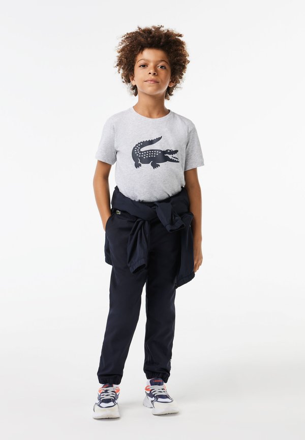 SPORTS JOGGERS - Tracksuit bottoms - abysm4