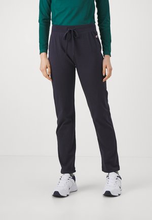 Pantaloni sportivi blu navy con cintura elastica e cordino regolabile; realizzati in materiale morbido. Presentano un piccolo logo sull'anca.