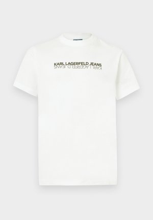 Valge puuvillane T-särk, millel on ümmargune kaelus ja lühikesed varrukad, ees bold tumedate tähtedega tekst "KARL LAGERFELD JEANS".