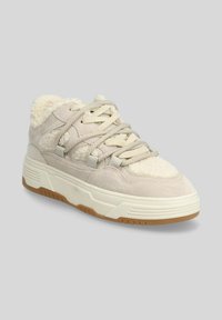 Sneaker beige con tessuto in suede e morbido, dotata di suola in gomma, design con lacci e dettagli testurizzati.