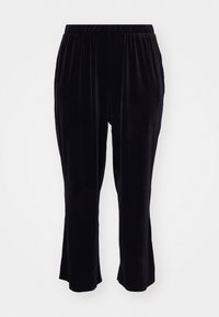 Pantalones de terciopelo negro con cintura elástica, diseño de piernas acampanadas y textura suave, con bolsillos laterales y un frente simple y sin costuras.