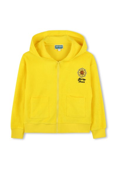 Gele ritssluiting hoodie van zacht terry stof, met een afbeelding van een zonnebloem aan de voorkant en twee voorzakken. Geribde manchetten en zoom.
