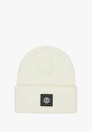 White beanie hat made of soft knit material, featuring a turned-up cuff and a black square patch with a logo on the front.