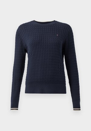 Navy blue knitted sweater with a textured cable pattern, round neckline, and ribbed cuffs featuring a white and red stripe detail.