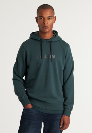 Hooded sweatshirt in dark teal fabric with a textured finish. Features a front logo in black and drawstrings at the hood. Casual fit.