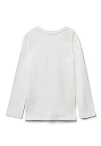 Tričko s dlouhým rukávem a kulatým výstřihem z bílé bavlny. Hladká textura, volný střih, s postranními rozparky na lemu pro snadnější pohyb.