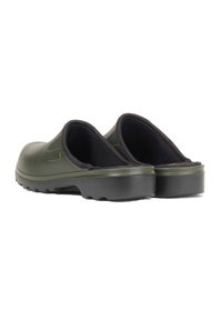 Dark green slip-on clogs with a textured upper, black lining, and a thick grip sole. Features a low back and rounded toe.