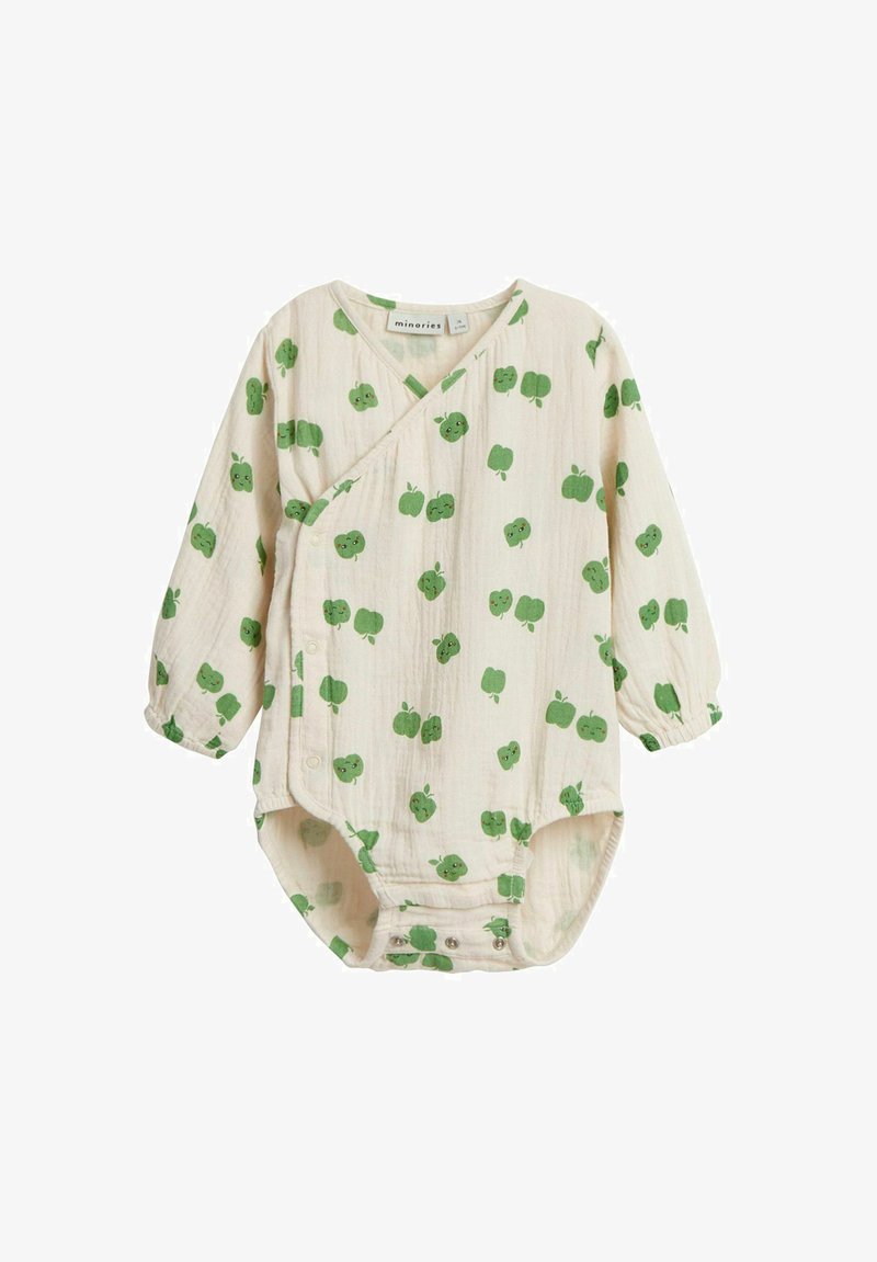 Vaalean beige vauvan bodysuit, jossa on pitkät hihat ja vihreä omena-kuvio. Valmistettu pehmeästä puuvillasta, jossa on napitus alaosassa.