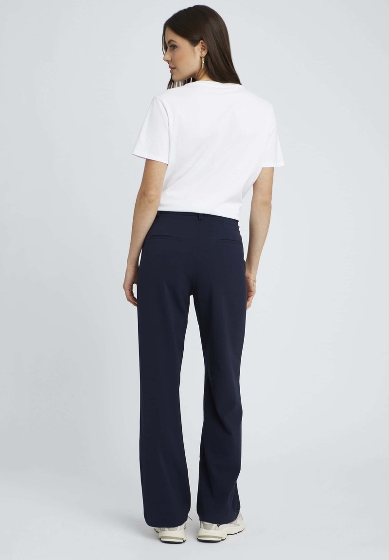 Pantalon chino bleu marine Maison Margiela, €487