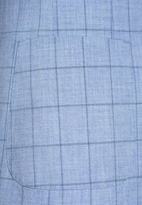 Light blue fabric with a subtle checked pattern and a large, rounded pocket. The texture appears smooth and tailored.