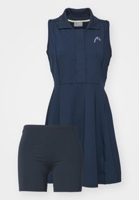 Robe de tennis sans manches bleu marine avec col et logo, assortie à un short ajusté bleu marine en dessous.