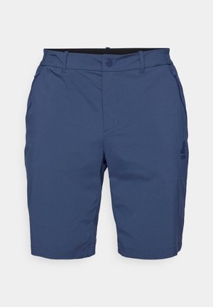 Navy blue shorts with a smooth texture, two side pockets, a button closure, and a subtle logo on the left leg. Tailored design, knee-length.