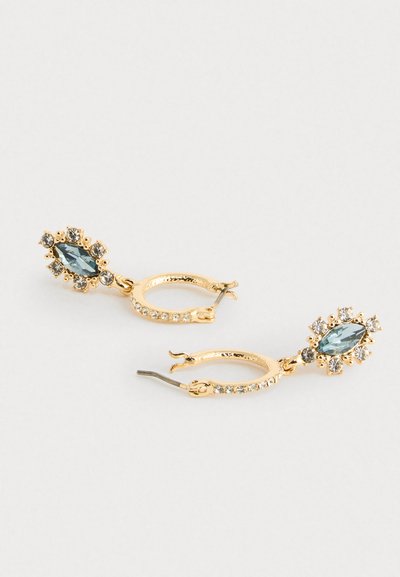 Gold hoop earrings with a blue marquise gem, surrounded by smaller clear crystals. Textured surface, secure clasp for closure.