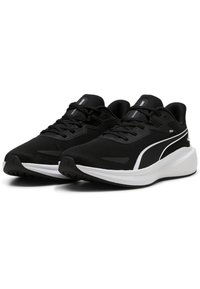 Scarpe da ginnastica nere con tomaia in mesh, dettagli bianchi e suola piatta in gomma. Presentano un design con lacci e dettagli del logo sulla linguetta e sul lato.