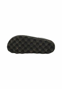 Suela de un zapato negro con un patrón texturizado en forma de burbuja y pequeñas manchas marrones sobre un fondo blanco.