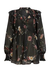 Blouse noire en tissu transparent à manches longues avec motif floral, devant plissé, col en V volanté, manches bouffantes et poignets froncés.