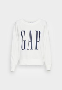 Felpa bianca in cotone con collo a giro, caratterizzata da grandi lettere blu navy "GAP" sul davanti e polsini e orlo a coste.