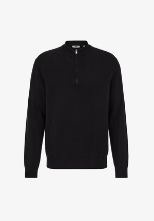 Juodas megztinis su pusiau užtraukiamu užtrauktuku ant apykaklės, ilgomis rankovėmis ir ribotais rankogaliais. Pagamintas iš lygaus audinio su vientisa tekstūra.