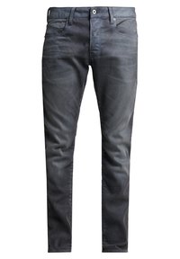 Jean slim fit gris foncé pour homme, avec poches avant, passants pour ceinture, bouton de fermeture et légère décoloration sur les cuisses et les genoux.