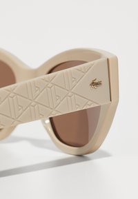 Lacoste Akiniai nuo saulės - sand