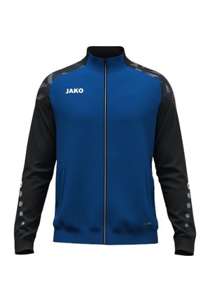 Blauw-zwarte sportjas met ritssluiting en JAKO-logo op de borst, patroon op de schouders en kleine stippen op de zwarte mouwen.