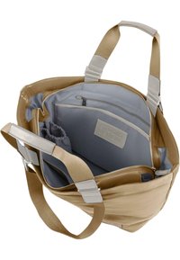 Beige tote bag med grå innside. Har to bærehåndtak, flere rom og en glidelåsrom. Glatt tekstur med matt finish.
