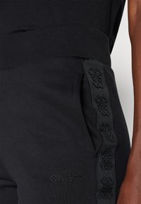 Guess STACIE JOGGER - Træningsbukser - jet black