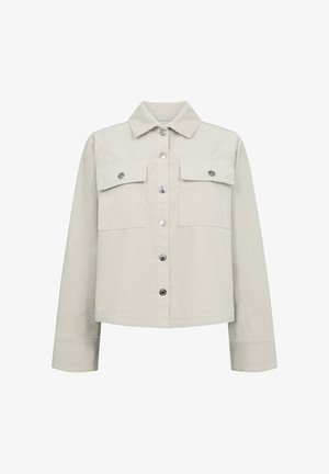Ljusbeige kordjacka med krage, framknappstängning och två bröstfickor. Har silverfärgade knappar och långa ärmar.