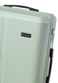 Green hardshell suitcase with vertical ribbed texture, black accents, a top handle, and a logo plate reading "WITTCHEN."