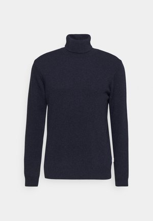 Marineblå turtleneck genser laget av strikket materiale, med lange ermer, ribbestrikket krage og mansjetter, og med et merke på nedre side.
