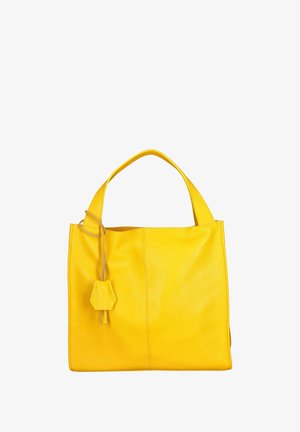Yellow leather tote bag with a structured shape, featuring a single handle and a hanging accent. Smooth texture with a subtle sheen.