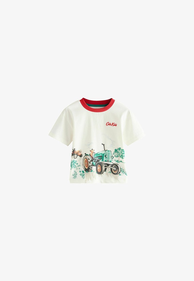 Valkoinen puuvillapaita, jossa on vihreä traktoriarkki, punaiset ribbireunat ja "Cat Kids" -logo. Lyhyet hihat rentoa istuvuutta varten.