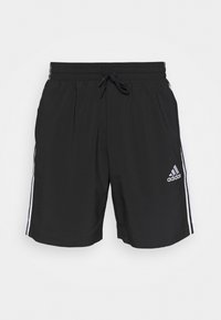 Svarta sportshorts med resårmidja och dragsko. Vita sidostriper och Adidas-logotyp i vitt på nedre högra sidan. Slät tyg.