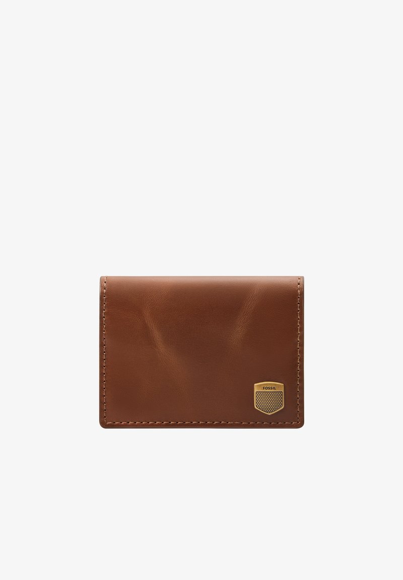 Brown leather wallet with a smooth texture, rectangular shape, and a gold-tone Fossil logo accent. Features minimal stitching detail.