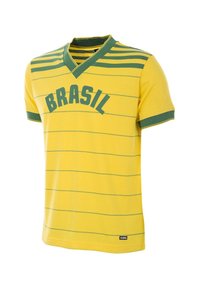 Gul kortärmad tröja med gröna ränder och "BRASIL" tryckt över framsidan. V-ringad krage och strukturerad tyg. Har logomärke.
