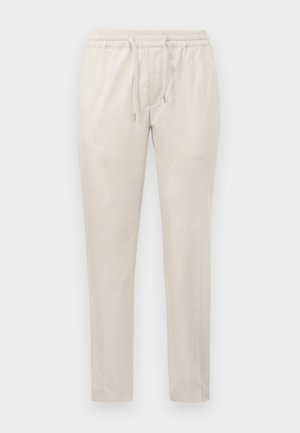 Beige lette bukser med elastisk liv og snøre. Lige ben og ingen synlige lommer, avsluttet med en glatt tekstur.